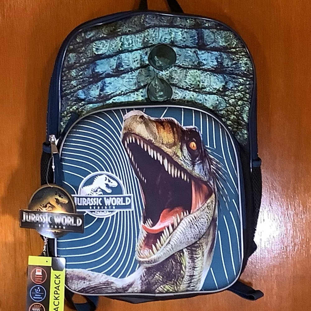 Jurassic World Dinosaur 17”  with horns in middle of Backpack